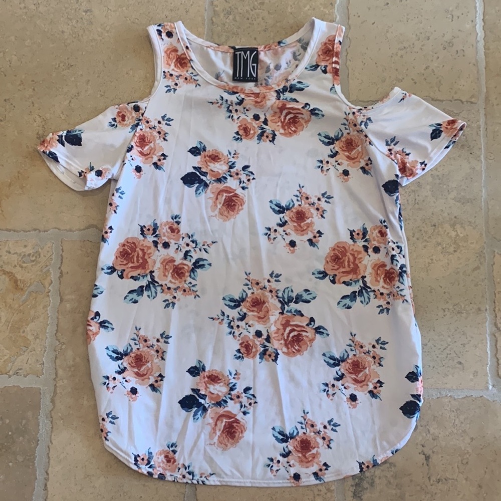 A cute top in the brand tmg